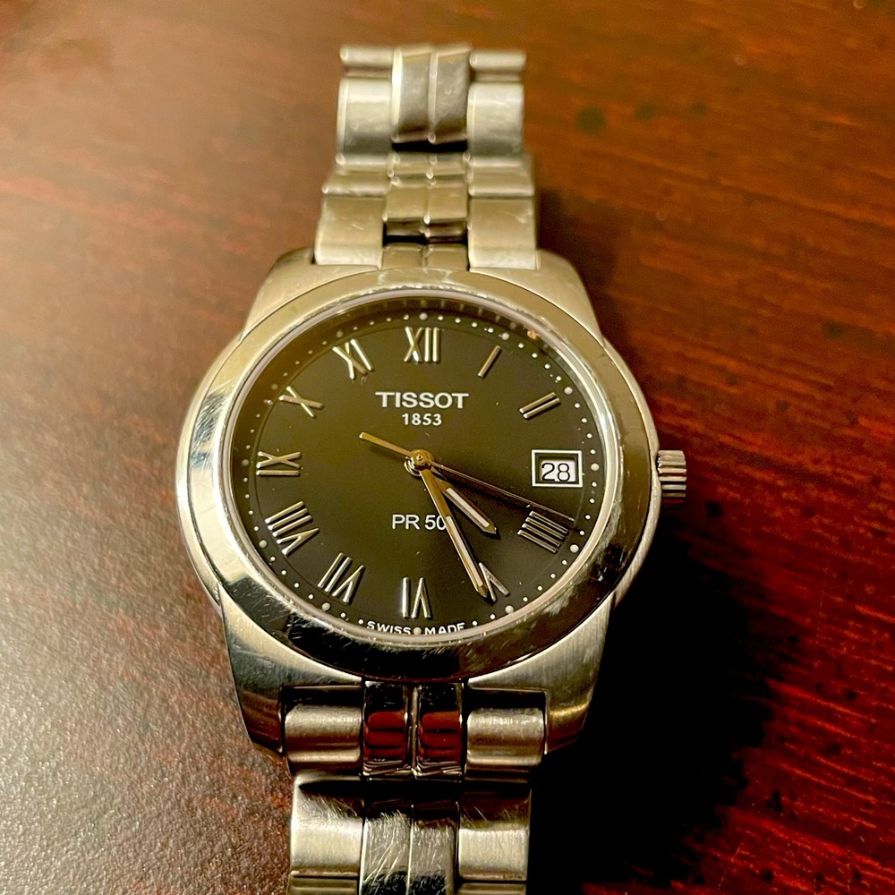 Stainless steel Tissot PR-50 mens wristwatch with sapphire crystal.